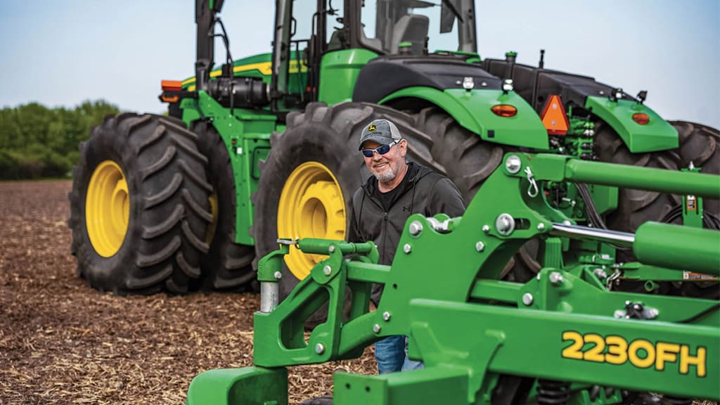 man in front of tractor